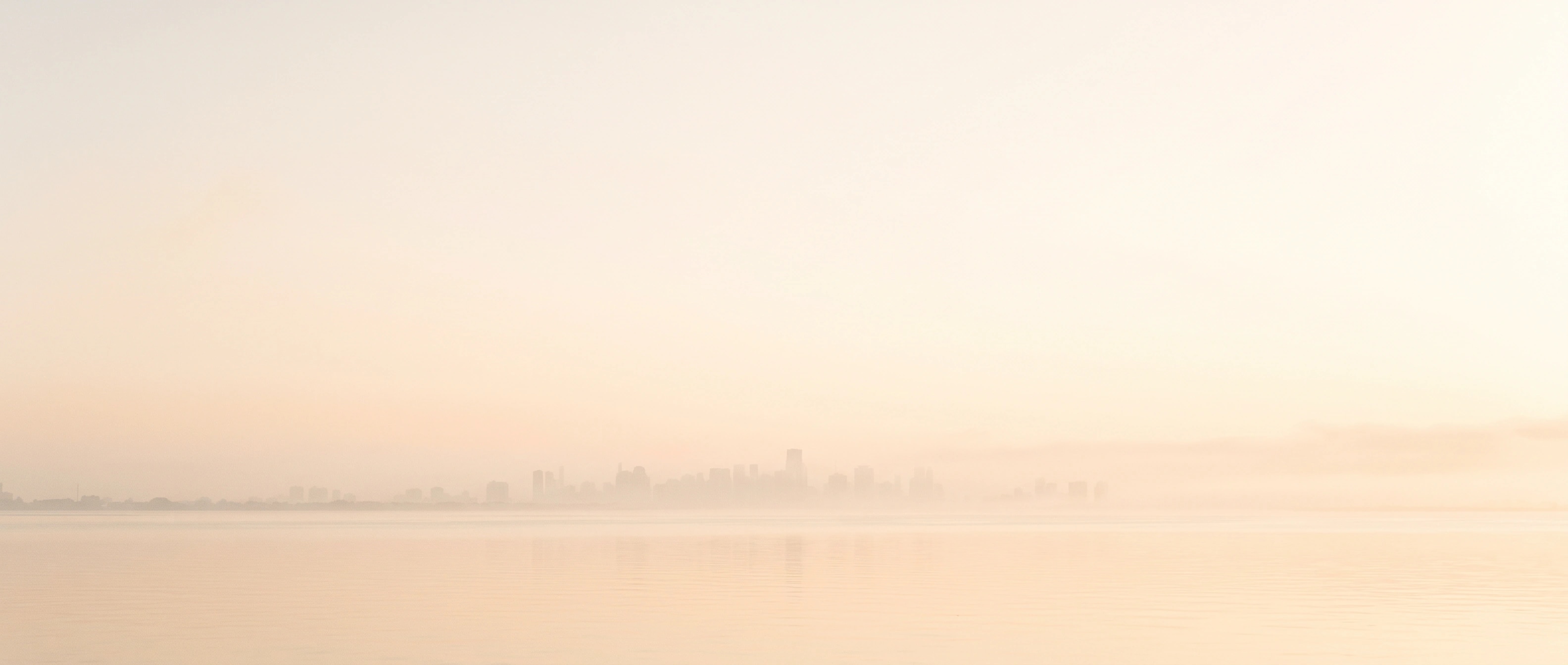 Miami skyline across the water in warm morning light